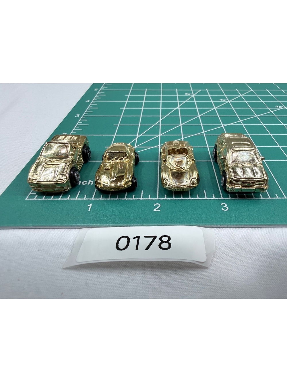 Set of 4 Vintage Gold Tone Galoob Micro Machine Toy Cars with Black Wheels